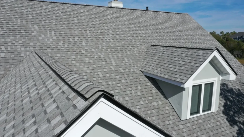 Ohio Storm Seasons: Preparing Your Roof for High Winds and Hail 7 Homeowner inspecting the roof for storm damage prevention in Ohio
