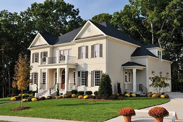 Roof replacement financing options you should consider for your home 4 A homeowner in Oklahoma reviewing roof replacement financing options with a roofing contractor.